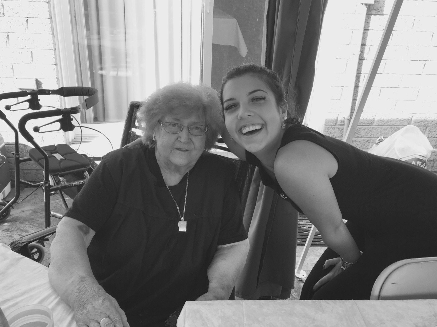 home care assistance agency caregiver coordinator during routine wellness check